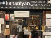 It Mattered to Her: Inside Vaydehi Khandelwal’s Ten-Year Journey to Bring Her Grandmother Back to Life The introductory placard describing Ghar Ki Kahaniyan as a museum of families and stories, displayed above a weathered, hand-bound personal diary