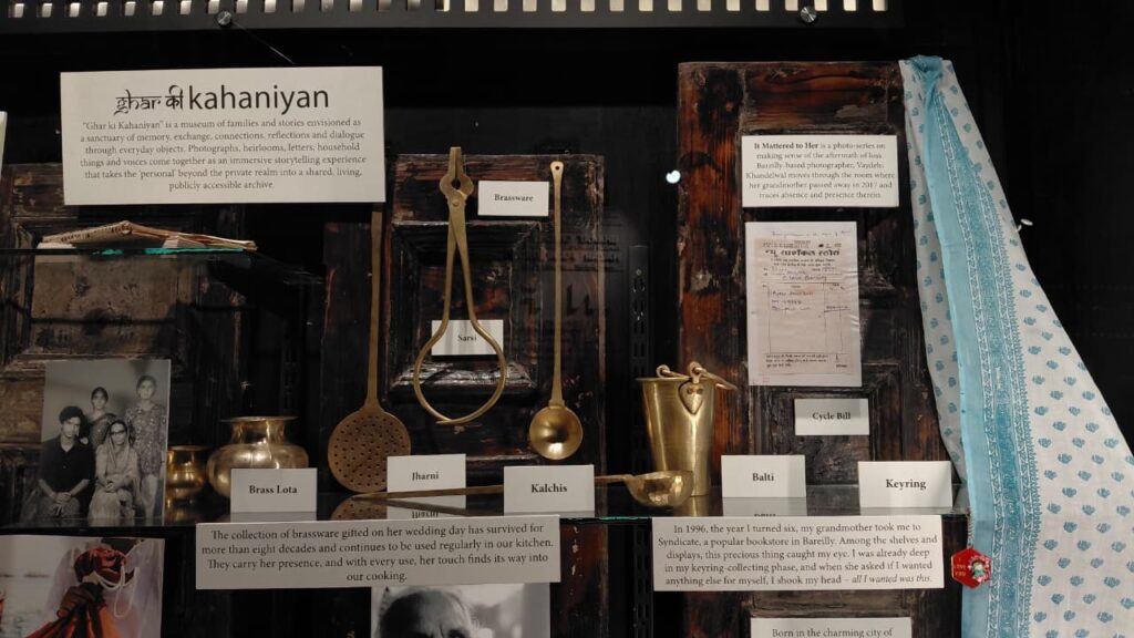 close crop of the Brass Lota / Jharni labels with the wedding-brassware placard and portrait